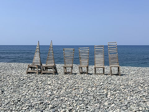 COMPLEMENTING the scenic pebbled beach view, unique wood art displays serve as the perfect backdrop throughout the property.