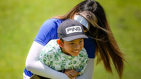 ETHAN Lago gets a victory hug from his mother after posting an impressive three-stroke victory to rule the boys’ 7-10 division of the ICTSI Alta Vista Junior PGT Championship in Cebu on Tuesday.