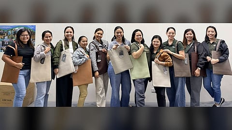 WOMEN of the Apo Agua team receive commemorative tote bags as a practical gesture of appreciation for their role in serving the Davao community.