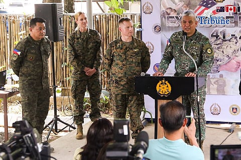 Office Chief Col. Xerxes Trinidad (far left), and US Combined Joint Information Bureau (CJIB) chief Lt. Col. Lindsay Pirek, USMC, meet with members of the media during a press briefing at Camp Aguinaldo in Quezon City on 14 April 2026. This year’s Balikatan exercises will involve at least 17,000 personnel from seven countries: the Philippines, United States, Australia, New Zealand, Japan, France, and Canada. | Toto Lozano