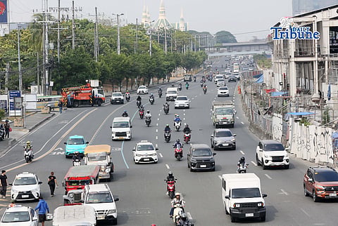 Motorists drive along Commonwealth Avenue in Quezon City on 17 April 2026. The Metropolitan Manila Development Authority observed a slight reduction in traffic on major roads as drivers adjust to rising fuel prices.