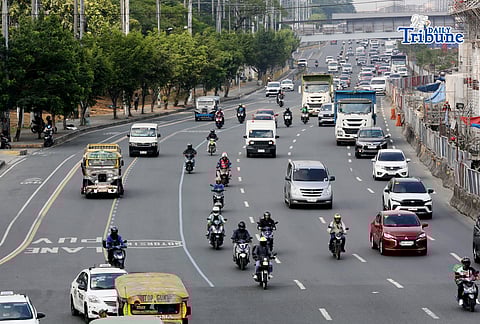Motorists drive along Commonwealth Avenue in Quezon City on 17 April 2026. The Metropolitan Manila Development Authority observed a slight reduction in traffic on major roads as drivers adjust to rising fuel prices.