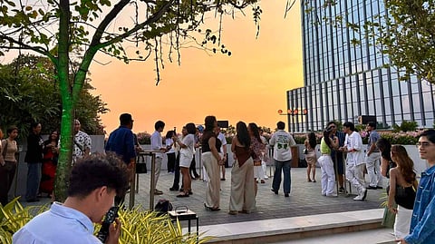 GUESTS gather for the TLI Radio Summer 009 sunset event at Solaire North, enjoying music, networking, and city views during the rooftop celebration.