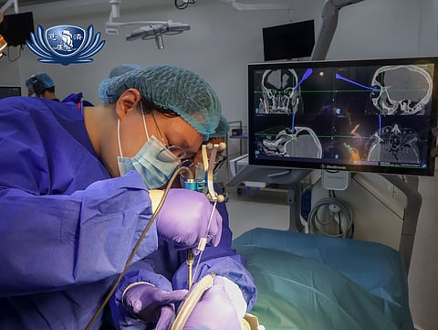 AN ophthalmologist tries the orbital neuronavigation system during the workshop on the technology. 