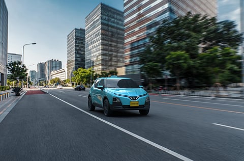 GREEN GSM electric vehicle travels through city streets as part of the Green SM Platform ride service network.
