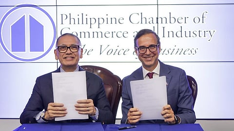 PHILIPPINE Chamber of Commerce and Industry president Perry Ferrer and European Chamber of Commerce of the Philippines president Paulo Duarte show the sealed memorandum of agreement for their collaboration to facilitate trade and investments between European and Philippine firms, in a recent signing ceremony in Taguig City.
