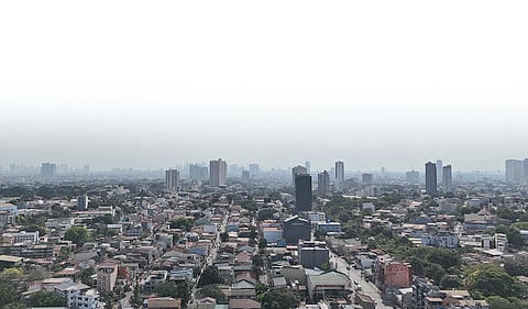 HAZE lingers over Metro Manila as smoke continues to billow from the contained fire at the closed Navotas City Sanitary Landfill, prompting the Environmental Management Bureau-National Capital Region to urge residents to remain cautious and wear masks against potentially harmful air pollutants.