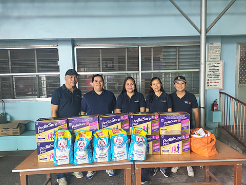 Rotary Club of AIM at the Missionaries of Charity Home of Joy for the Sick Children in Tayuman Sunday, donating milk products for tube-fed children in the orphanage.
