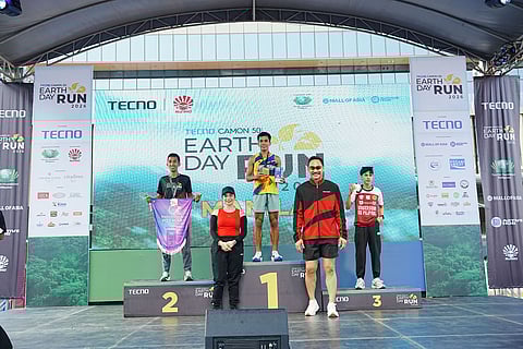RITCHIE Estampador (center) celebrates after winning over James Kevin Cruz in the men's 21K run of the Earth Day Run 2026 Manila leg at the SM Mall of Asia Complex on Sunday.   