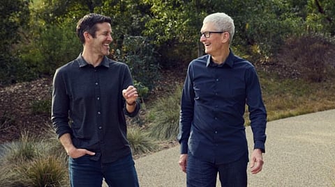 JOHN Ternus and Tim Cook (right) walk along Apple Park. 