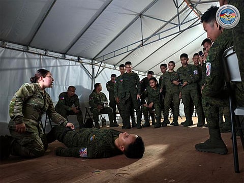 Philippine and U.S. Armed Forces personnel apply lifesaving techniques and perform hands-on emergency medical procedures during the Tactical Combat Casualty Care (TCCC) Training  at Daniel Z. Romualdez Airport in Tacloban City, Leyte, under Exercise Balikatan 41-2026.
