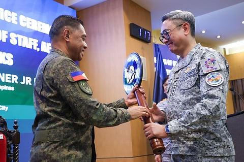 AFP Chief of Staff General Romeo S Brawner Jr PA hands over the office symbol to Lieutenant General Rommel P Roldan PAF as he assumes his post as Vice Chief of Staff, AFP, during the Joint Assumption of Office and Donning of Ranks Ceremony on April 20 at Camp Aguinaldo.