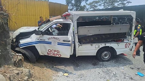 QUEZONCity Police District personnel and investigators inspect a police vehicle involved in a fatal crash along Payatas Road on Friday. Five persons under police custody were declared dead on arrival and another remains in critical condition.