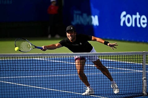 FRANCIS Casey Alcantara displays his form en route to posting a 6-0, 6-2 over John Kendrick Bona to reach the semifinals of the Philta Men’s Open at the Rizal Memorial Tennis Center on Friday. 