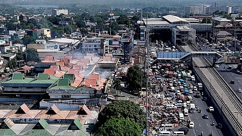 AN aerial view shows the massive fifth-alarm fire that engulfed the Commonwealth Market in Quezon City on Saturday morning, 25 April 2026.
