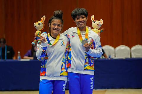 ANNIE Ramirez and Emily Thomas celebrate after winning the gold and silver medals for the Philippines in the jiu-jitsu event of the 6th Asian Beach Games in Sanya, China.    