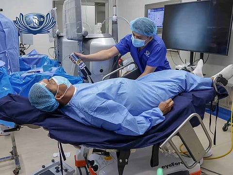 CATARACT patient Efraim Flores is prepared for surgery in a special operating bed.