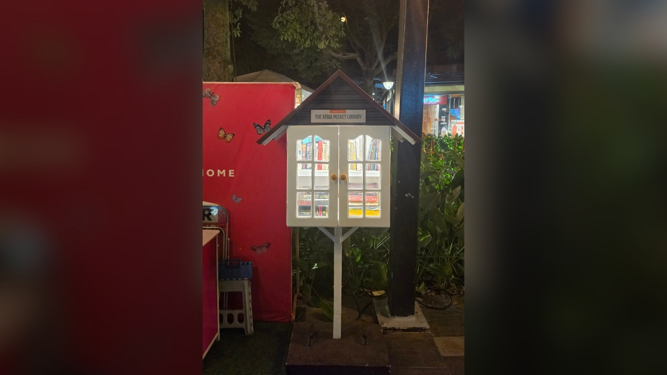 A SELF that looks like a bird house, full of books at The Shops at Atria inviting passersby to pause and read.