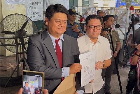 Atty. Mans Carpio and a member of his legal counsel Atty. Peter Paul Danao filing a complaint against the Bangko Sentral ng Pilipinas (BSP), Anti-Money Laundering Council (AMLC), and members of the House Committee on Justice before the Quezon City Prosecutor’s Office this Monday.