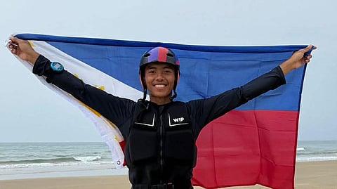 Dhenver John Castillo beams with pride after getting a silver in sailing in the sixth Asian Beach Games in Sanya, China.