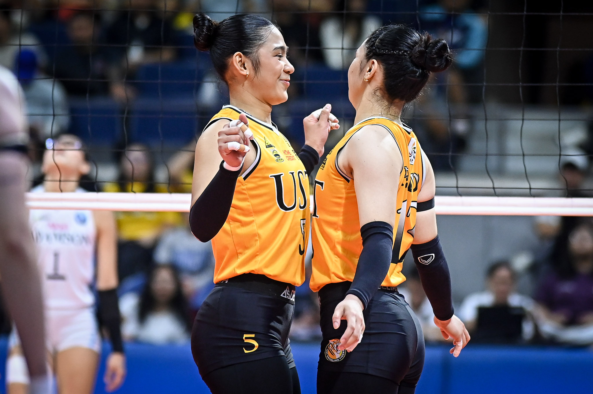 AVRIL Bron and Jonna Perdido celebrate after the UST Tigresses eliminated the Adamson Lady Falcons, 25-16, 25-18, 25-19, in the stepladder semifinals of the UAAP Season 88 women’s volleyball tournament on Wednesday at the Smart Araneta Coliseum.