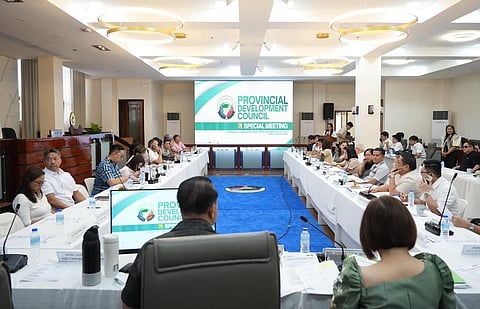 Vice Gov. Dennis “Delta” Pineda (back view, seated on gray chair) leads PDC meeting, 28 April.