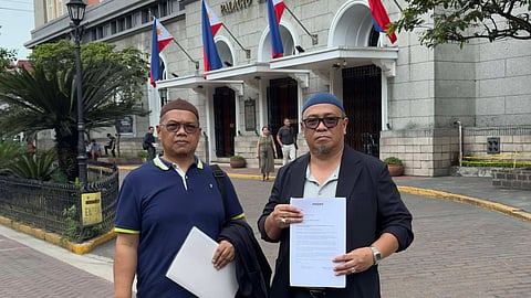 Sultan Alim Saad I. Amate and Maulana L. Mamutuk standing before COMELEC to deliver their letter urging the Supreme Court and the Commission on Elections to immediately resolve contested redistricting laws and party accreditation rules ahead of the filing of candidacies for the first Bangsamoro parliamentary elections.