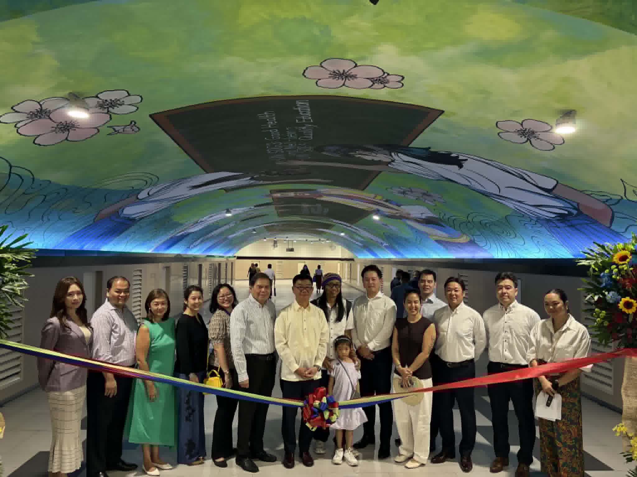 Artist AG Saño, executives from Security Bank and Mitsubishi UFJ Financial Group (MUFG) lead the ribbon cutting ceremony for the 10th anniversary mural launch at the Paseo de Roxas Underpass, Makati City on Thursday, 30 April. 