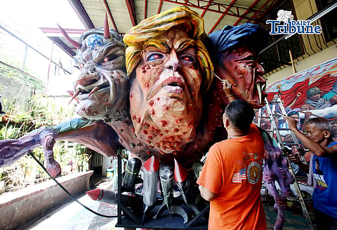 (April 30 2026) On Thursday April 30 2026 in Quezon City ahead of Labor Day, an Artists apply finishing touches at the effigy named “Trio Delubyo” for Labor Day protest on May 1 2026, The effigy featuring US President Donald Trump, Israel Prime Minister Benjamin Netanyahu and President Ferdinand Marcos Jr. , fused into a lizard-like entity signifies decaying state of imperialism and its “attempts” to maintain global dominance while rockets embedded in its body depicts the United States’ continued war amid its waning influence in West Asia. Photo/Analy Labor
