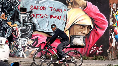 EACH year passes with the calls of Filipino workers for higher wages and lower prices of basic commodities seemingly unheard, as depicted in a mural along Himlayan Road in Quezon City on Friday, 1 May.