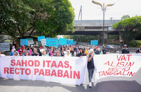 Residents of Batangas conducting a protest in Manila on Labor Day calling for the increase in minimum wage, VAT abolishment, and the removal of Finance Secretary Ralph Recto from his post.