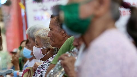 SENIOR citizens line up at the Department of Social Welfare and Development Central Office in Quezon City to receive their P6,000 pension payout.
