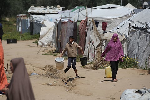 PEOPLE fetch drinking water at the Bureij camp for Palestinian refugees in the central Gaza Strip on 28 April 2026.
