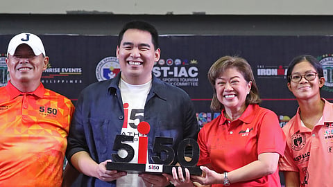 CAMIGUIN Gov. XJ Romualdo (second from left) holds the Camiguin 5150 M-Dot trophy during the press conference ahead of the IRONMAN 5150 Camiguin race set on Sunday. Joining him are (from left) Rep. JJ Romualdo, Sunrise Events Inc. president Princess Galura, and multi-titled triathlete Bea Quiambao.   

