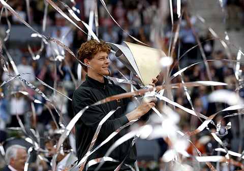 Italy's Jannik Sinner celebrates with his trophy after winning the 2026 ATP Tour Madrid Open tennis tournament final singles match against Germany's Alexander Zverev at the Caja Magica in Madrid, on 3 May 2026.
