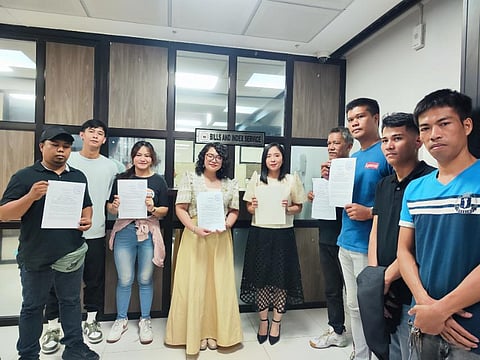 Gabriela Women's Partylist Rep. Sarah Elago (right), Kabataan Partylist Rep. Renee Co (left), and labor leaders filed a House Resolution at the House of Representatives this Monday to seek a probe into a reported and recent mass layoff of Kowloon House workers.