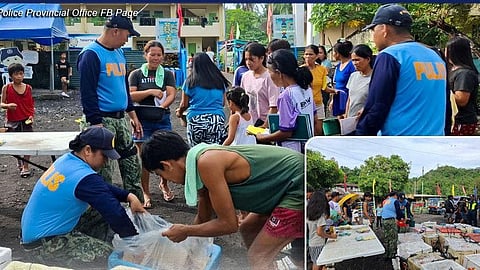 PNP distributes 2.5 tons of sardines to evacuees in Camalig, Albay