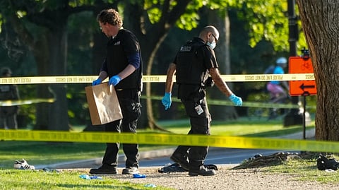 CRIME scene technicians catalog evidence following an exchange of gunfire between a US Secret Service agent and a gunman on the National Mall in Washington, D.C.