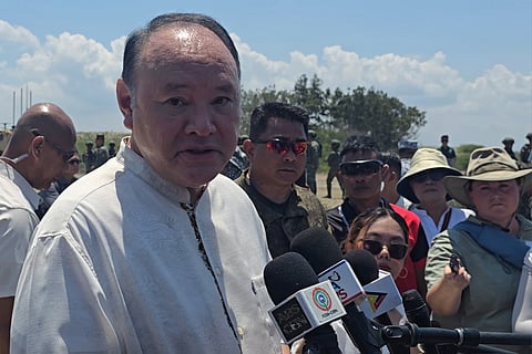 Defense Secretary Gilberto “Gibo” Teodoro Jr. speaks to reporters during an ambush interview shortly after the Japanese troops launch two rounds of missiles from its Type 88 missile system in in Paoay, Ilocos Norte on 6 May 2026. Teodoro, alongside Japanese Defense Minister Shinjiro Koizumi also engaged with Japanese troops actively participating Exercise Balikatan. (Photo by Lade Kabagani)