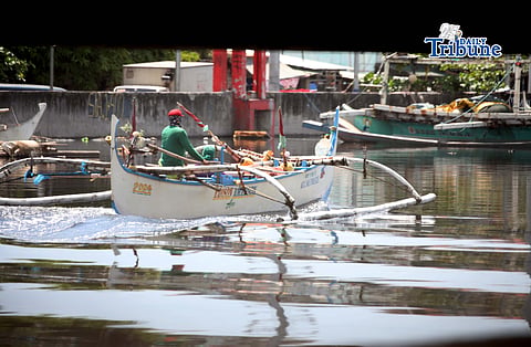  (May 06 2026) Fishers riding a fishing boat passing at the bridge of Pasiwata bridge boundary of Caloocan and Navotas City, on Wednesday May 6 2026, the Department of Agriculture-Bureau of Fisheries and Aquatic Resources (DA-BFAR) has initiated the distribution of P3,000 fuel subsidies to qualified fisherfolk across various regions in the Philippines as of March and April 2026, aimed at cushioning the impact of rising fuel prices. Photo/Analy Labor