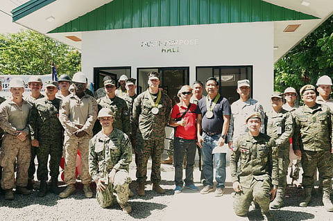 PH and US troops inaugurated a new multi-purpose hall in Barangay Tibulao, Carmen, Davao del Norte, under Balikatan 41-2026, boosting community development, disaster preparedness, and humanitarian assistance through medical missions, livelihood support, and strengthened AFP-US partnership.