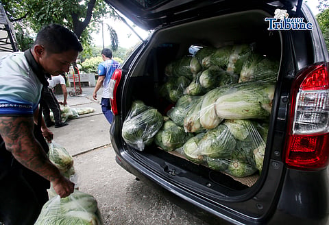 (May 07 2026) TTMD Personnel load vegetables after it was delivered from Atok, Benguet to the Quezon City hall compound on Thursday, May 7, 2026, as they distribute it to tricycle todas as part of the Project Unified Buying and Bayanihan Operations, a joint project of Atok and Quezon City LGU. Photo/Analy Labor