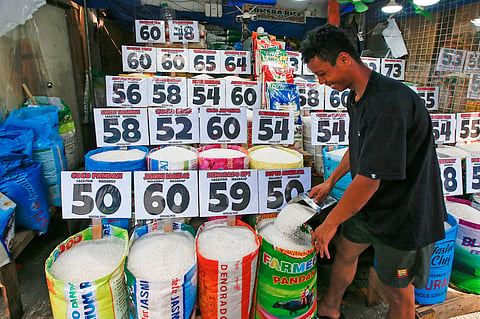 A vendor displays various local and imported rice varieties at a stall in Central Market, Manila, on Thursday. President Ferdinand Marcos Jr. has directed Agriculture Secretary Francisco Tiu Laurel Jr. to implement urgent measures to bring down rice prices and protect consumers from market manipulation.