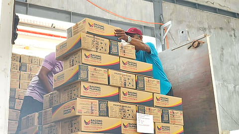 FOOD packs from the Department of Social Welfare and Development are being unloaded by workers. They are set to be delivered to provinces in the Bicol region affected by the eruption of the Mayon Volcano.