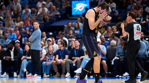 LUKA Doncic grimaces in pain after suffering a hamstring injury during the Los Angeles Lakers’ 96-139 loss to the Oklahoma City Thunder on 2 April.