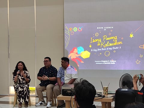 (From left to right) Dr. Gay Jane Perez, writer Eugene Y. Evasco, and illustrator Henrick Dulin at the book launch event of "Isang Puwang sa Kalawakan: Si Gay Jane Perez at ang Diwata-1" at the UP Diliman College of Science, Quezon City Friday.