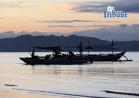(May 09 2026) Fishermen riding at their boat early morning going to deep sea to catch fish in Iloilo City. Some Municipal fisherfolk are bearing the brunt of the high cost of fuel, but they have difficulty catching fish because of the competition from large fishing companies, that are now allowed to catch in their traditional fishing ground. Photo/Analy Labor