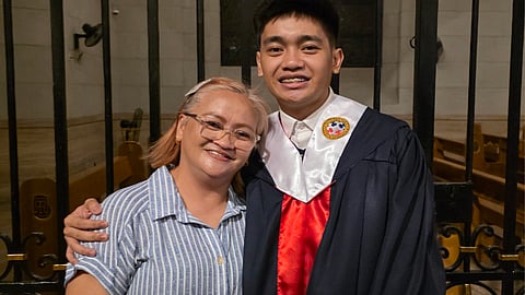 Rhoda Orcullo (left) sharing a moment with her son Jerod Orcullo (right), a reporter for the Daily Tribune, during the latter's college graduation from Colegio de San Juan Letran. 