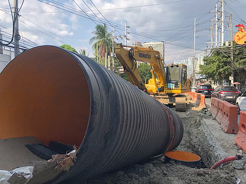 SOON TO FINISH: The ongoing Phase 1 drainage construction, involving the laying of 1.5-meter High-Density Polyethylene (HDPE) pipes, along E. Rodriguez Sr. Avenue in Brgy. Tatalon, Quezon City. (Photographed by Sean Magbanua for the Daily Tribune)