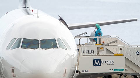 A BRITISH citizen boards a plane bound for the United Kingdom carrying passengers evacuated from the Dutch flagged hantavirus-stricken cruise ship MV Hondius at the Tenerife Sur-Reina Sofia airport on the island of Tenerife in Spain’s Canary Islands on 10 May 2026.